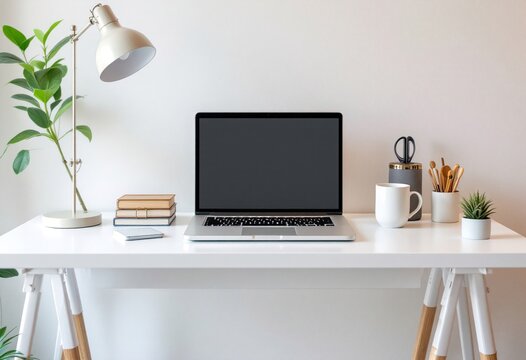 Modern home office desk with laptop, lamp, and plants. Minimalist workspace setup for remote work. Clean white interior design for productivity and focus - Powered by Adobe