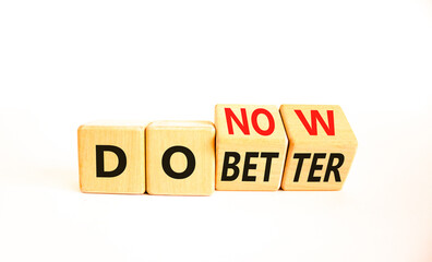 Do better and now symbol. Concept words Do better Do now on wooden block. Beautiful white table white background. Business do better and now concept. Copy space.