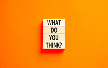 What do you think symbol. Concept words What do you think on beautiful wooden blocks. Beautiful orange table orange background. Business and What do you think concept. Copy space.