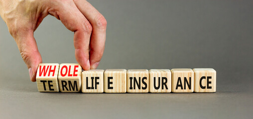 Term or whole life insurance symbol. Concept words Term life insurance or Whole life insurance on wooden blocks. Beautiful grey background. Business term or whole life insurance concept. Copy space.