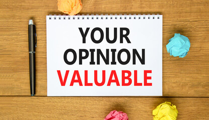 Fototapeta premium Your opinion valuable symbol. Concept words Your opinion valuable on beautiful white note. Beautiful wooden background. Black pen. Colored paper. Business your opinion valuable concept. Copy space.