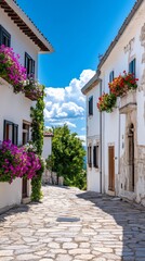 Fototapeta premium A charming spring European street lined with pastel colored buildings blooming flower boxes on windows and cobblestone streets under a bright blue sky 