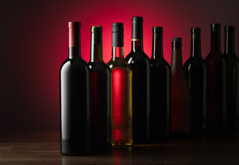 Bottles of wine on a old wooden table.
