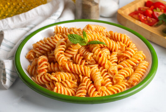 Fusilli pasta, spiral or spirali pasta with tomato sauce - Italian food style
