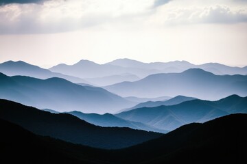Obraz premium A distant view of a mountain range with varying elevations and terrain