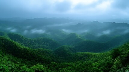Naklejka premium Misty green mountain range landscape.
