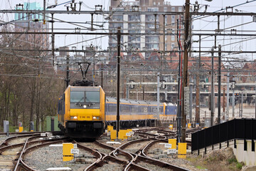 Traxx locomotive with intercity direct passenger train arriving at Rotterdam Central Station