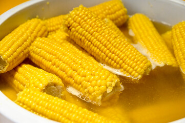 Boiled corn. Boiled corn cobs in salt water.