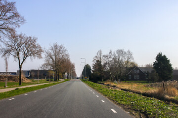 Fototapeta premium Main road Middelweg after harvest in the Zuidplaspolder where new village Cortelande will arise