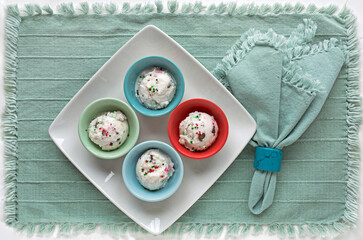 Mini Bowls of Confetti Snow Ice Cream on Teal Place Mat