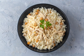 Traditional delicious Turkish food; Rice with chickpeas and chicken (Turkish name; Tavuklu nohutlu pilav or pilaf)
