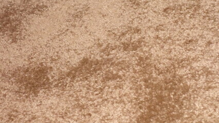 Close-up of soft, plush beige carpet texture, showcasing its intricate fibers.