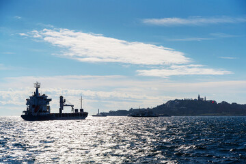 A large cargo ship sails towards Istanbul, Turkey, transiting the Bosporus 