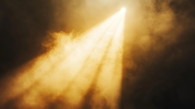 Golden spotlight cutting through smoky stage haze