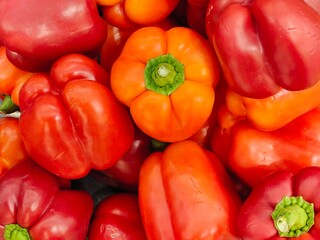 Yellow and red bell peppers, red capsicum in the store