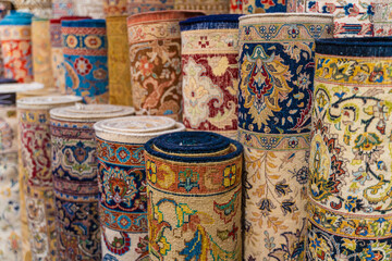 Traditional Turkish carpets are offered for sale at a bazaar