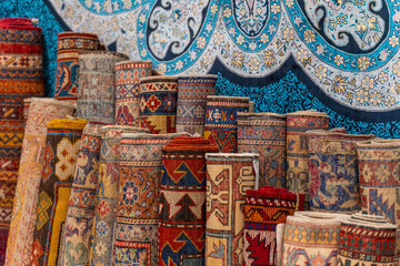 Traditional Turkish carpets are offered for sale at a bazaar
