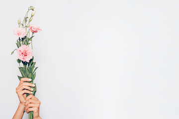 A person holding a bouquet