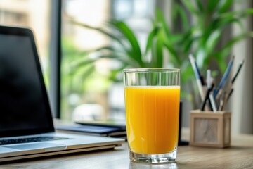 Refreshing juice on an office desk enhancing a healthy work environment and productivity during the workday