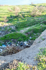 Ecological disaster. Garbage among the hills.