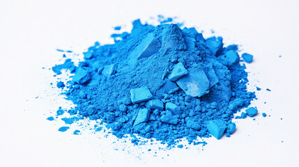 Vibrant blue pigment pile on white background