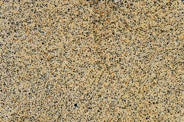 Tiny pebbles embedded in sandstone. Photography resource. Backdrop. Graphic resource.