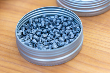 Metal air rifle ammunition in round metal box in a shooting competition