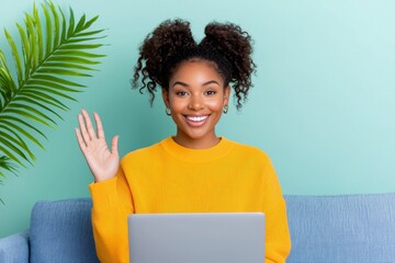 At home, a young African businesswoman sits in front of her laptop, engaged in an internet meeting. She works as a freelance entrepreneur.