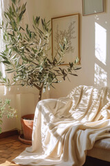 Cozy bohemian living room with light beige walls, olive tree, and elegant minimalist decor