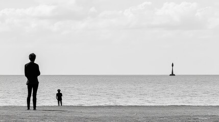 Two figures on the beach overlooking the ocean.