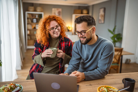 couple use laptop for work or fun while have break for lunch - Powered by Adobe
