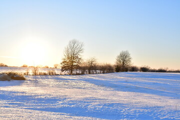 Sunset Over Snowy Field