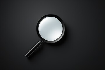 a close up of a magnifying glass on a black surface
