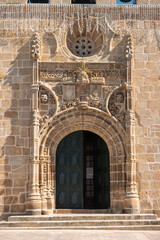 Facade of the sixteenth century Gothic Manueline church with a three bells belfry,in the town of Vila Nova de Foz Coa, Portugal.