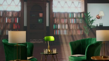 Empty book filled traditional study room with green armchairs and warm wood tones exudes a cozy upscale atmosphere. Space ideal for elite aristocracy gatherings and drinking whiskey.