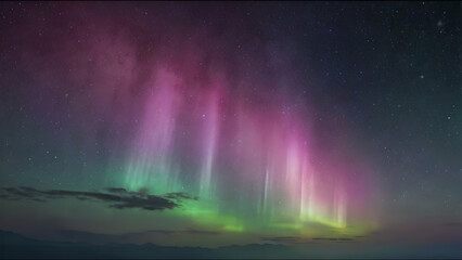 Naklejka premium A vibrant aurora borealis illuminates the night sky with dancing lights, mirroring a celestial rainbow across the dark landscape