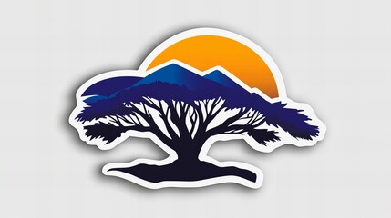 Silhouette of a tree against a vibrant sunset and mountains. A peaceful nature scene.