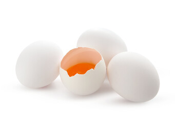Cracked and whole chicken eggs isolated on white background, closeup