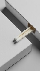 Two matches in a white box.