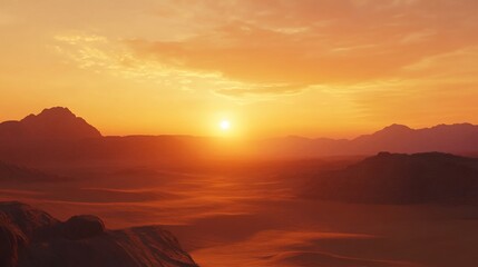 Fiery sunset over a vast, orange desert landscape with hazy mountains.