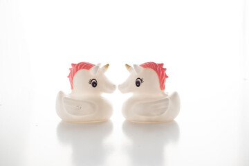 Two lovely unicorns looking at each other.