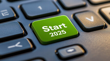 Close up of keyboard featuring prominent green button labeled Start 2025, symbolizing new beginnings and opportunities in upcoming year