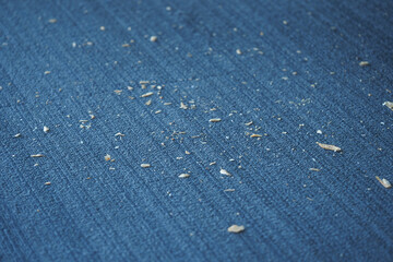 Small Dust Particles on a Blue Fabric Surface Are Visible to the Eye