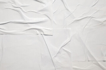 white crumpled and creased glued wrinkled paper poster texture background