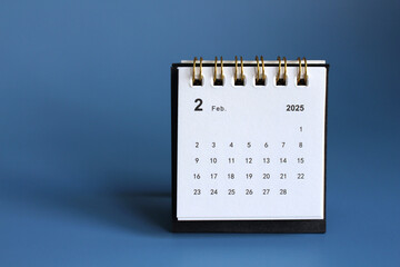 Monthly calendar template for the new year 2025 desk calendar,isolated on Blue background.