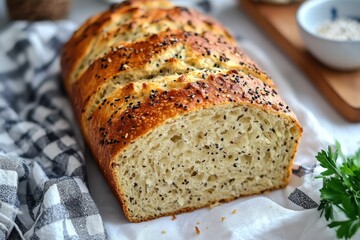 Freshly Baked Bread Loaf with Black Seeds on a White Background