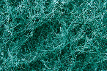 Abstract teal green tangled threads, intricate woven texture background. Perfect for design projects needing a complex, interwoven pattern.