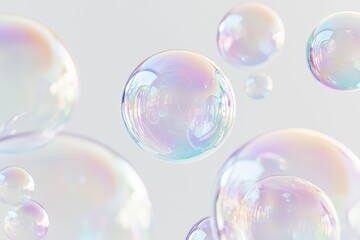 A set of iridescent soap bubbles floating against a white background
