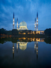 The Beautiful Sultan Salahuddin Abdul Aziz Shah Mosque during bloue hour (also known as the Blue Mosque), Shah Alam. (Shallow DOF, slight motion blur)