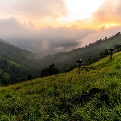Obraz premium Serene Sunset Landscape Hilltop Cameras Capture Misty Valley